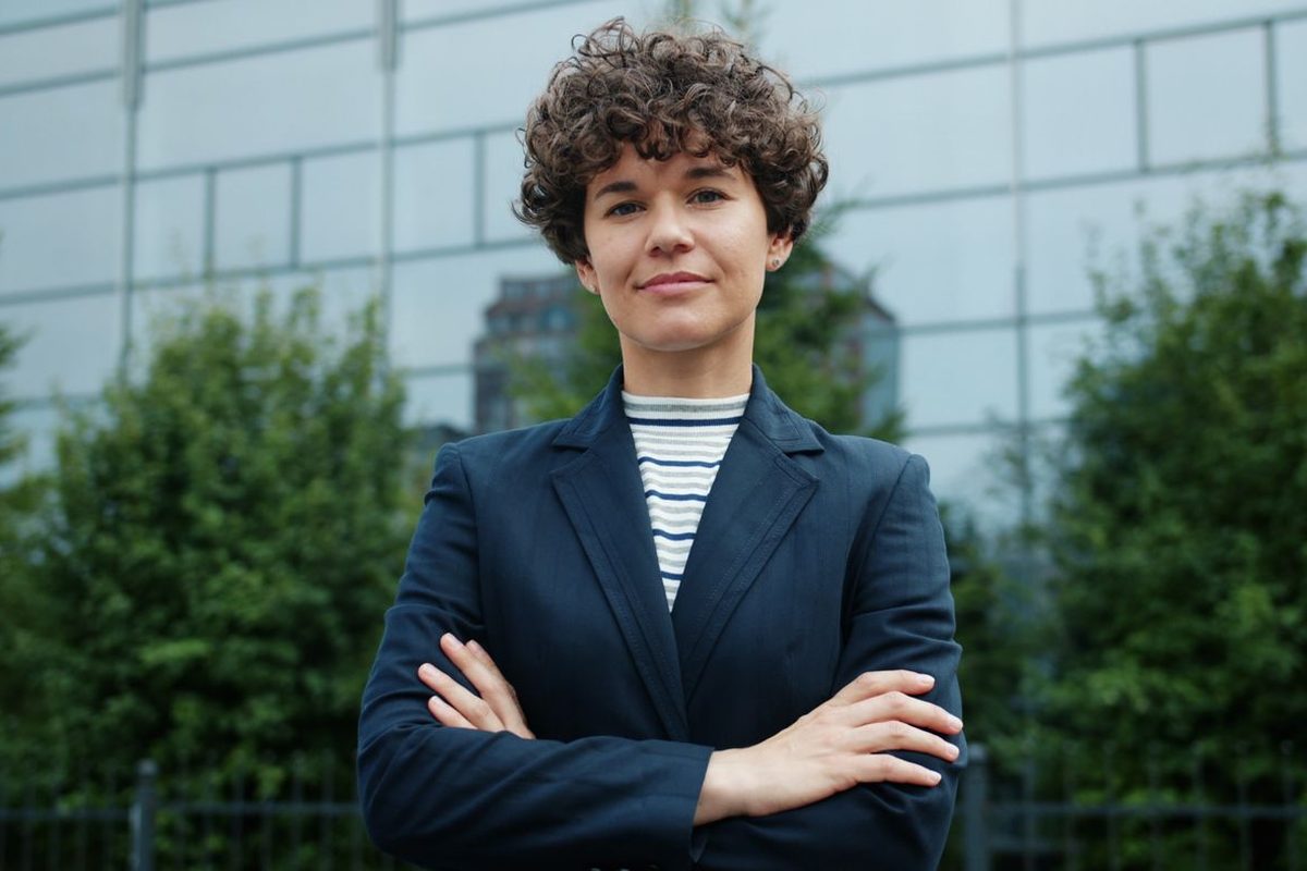 A property professional standing outside a modern commercial building